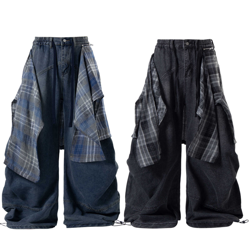 Front view of layered plaid baggy jeans with wide denim legs and a visible side zipper detail
