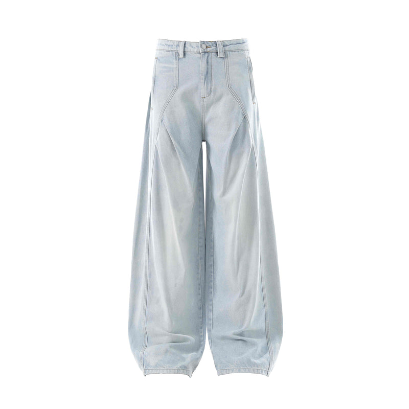Front view of light wash wide-leg balloon jeans with curved panel seams and side pockets