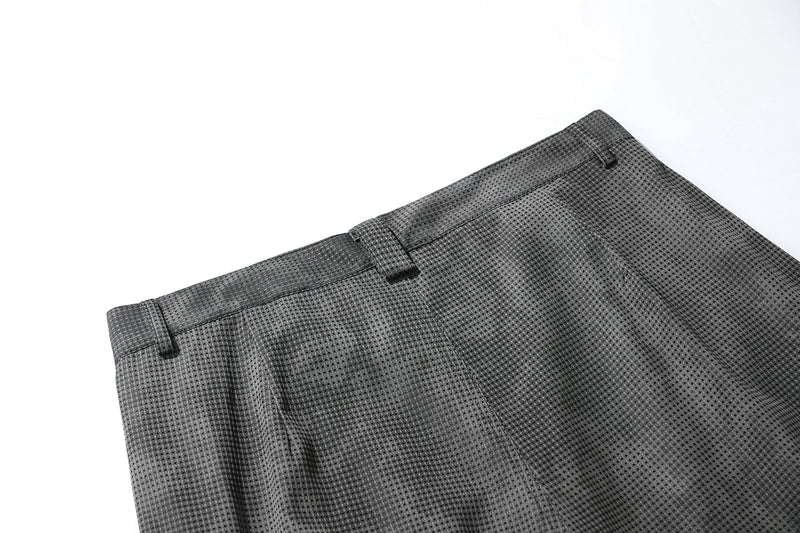 Close-up of black mesh shorts back waistband with belt loops and seam detail