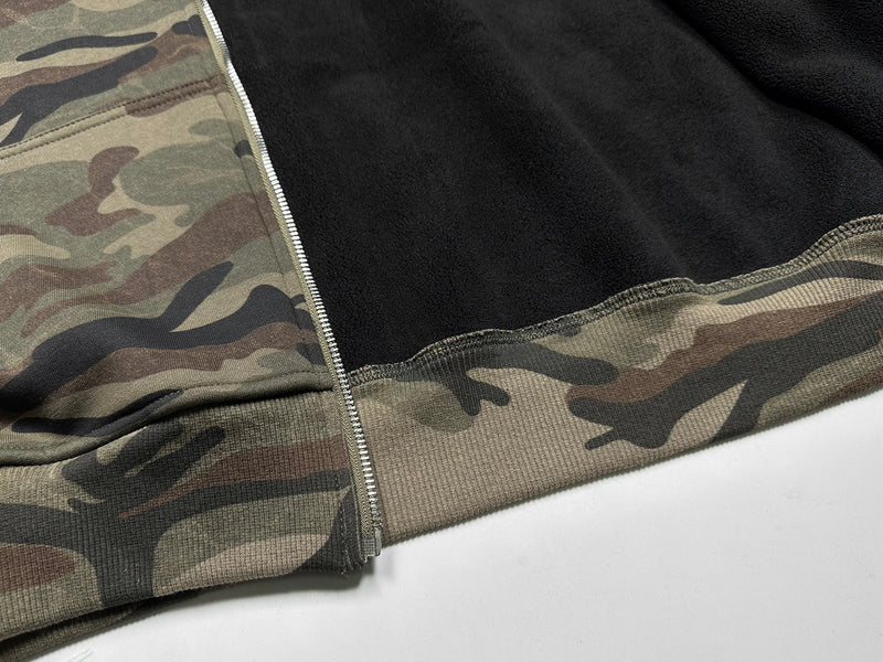 Open front view showing black fleece interior and camo outer fabric
