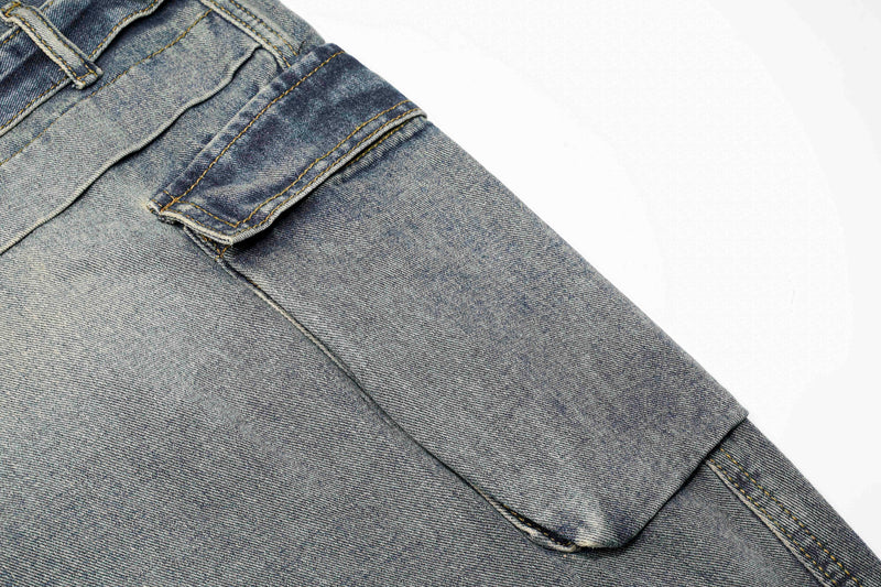 Close-up of blue jeans cargo pocket and layered side panel seam