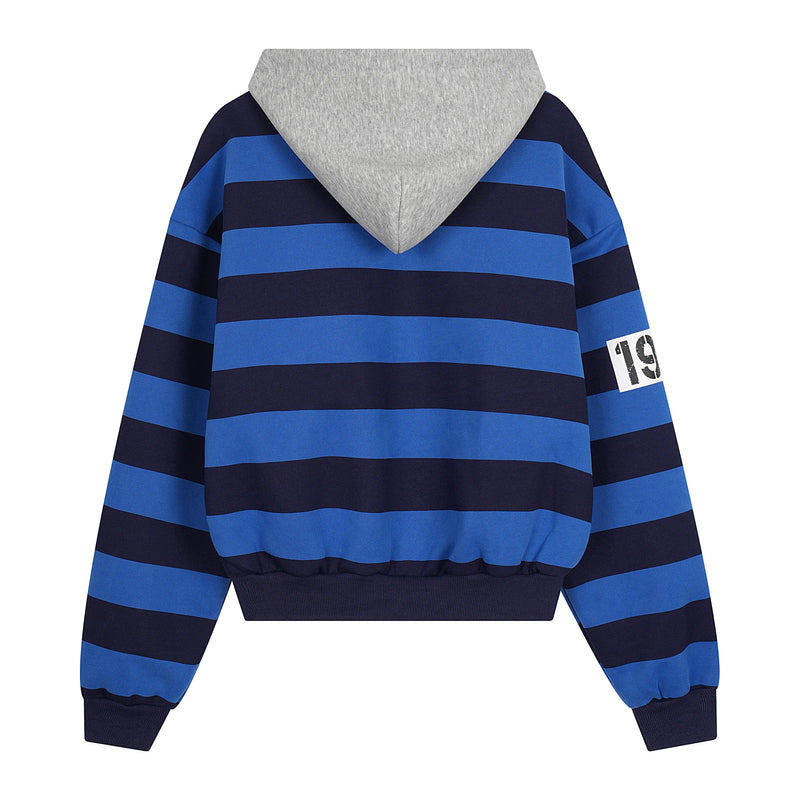 Back view of blue and black striped zip-up hoodie with gray hood and number patch on sleeve