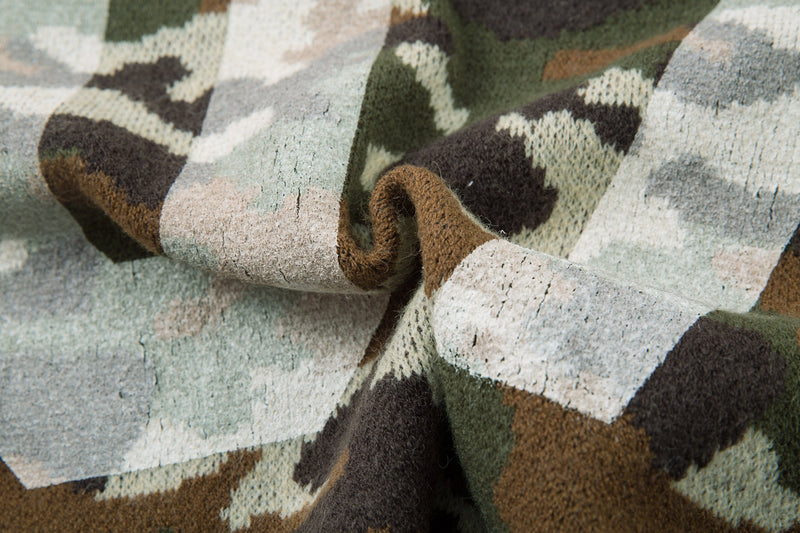 Close-up of the knit fabric and seam on a beige camouflage zip-up hoodie