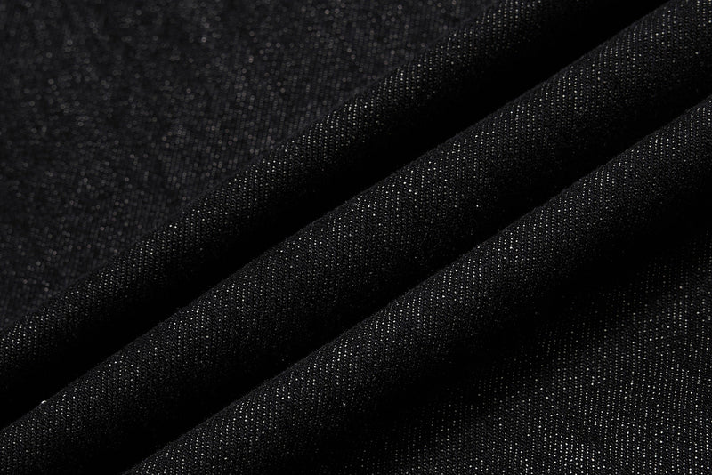 Close-up of black denim fabric texture with soft folds