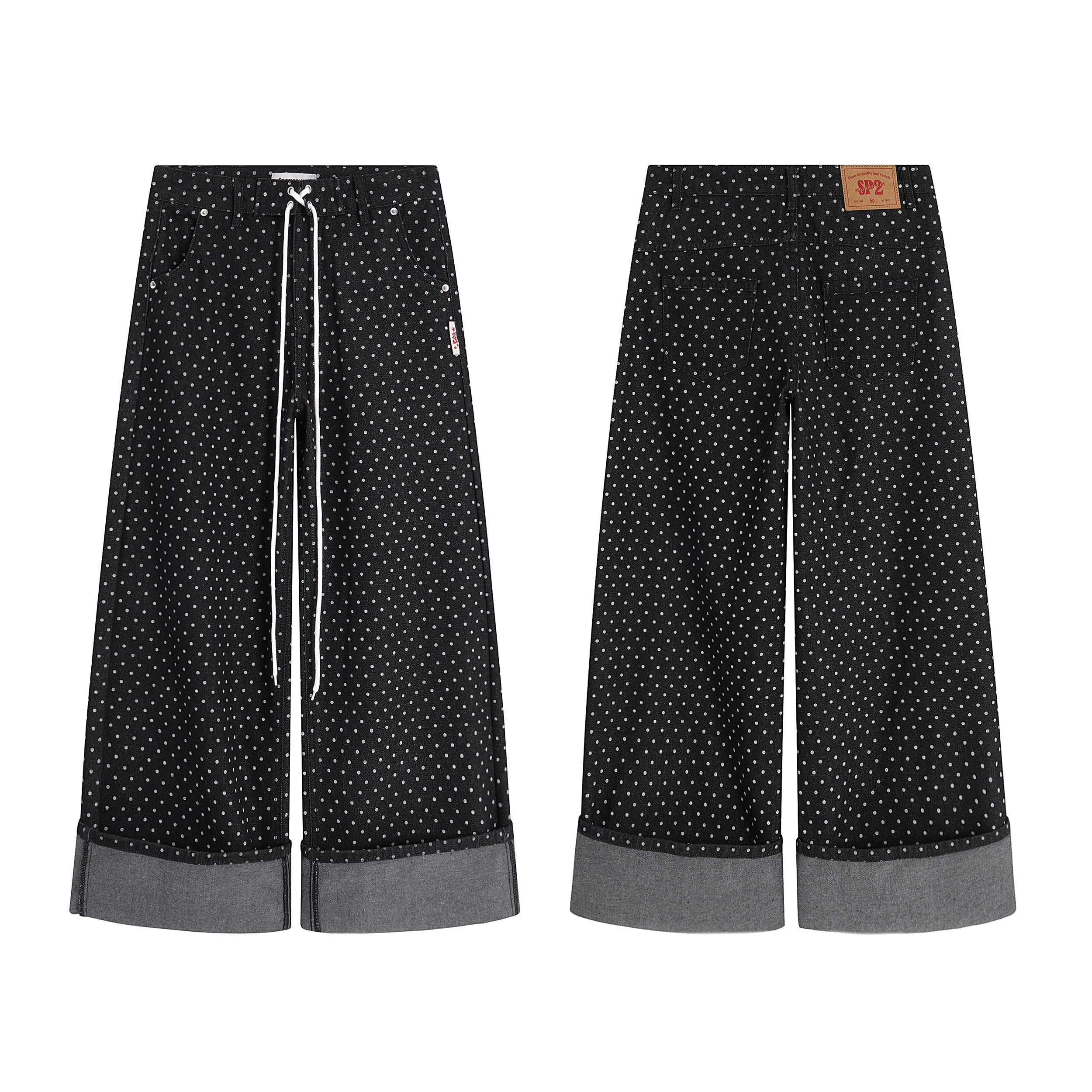 Front and back view of black polka-dot wide-leg denim pants with grey turn-up cuffs and white drawstring waist