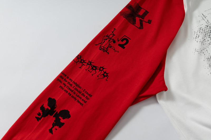Close-up of red sleeve with black graphic print on raglan long-sleeve T-shirt