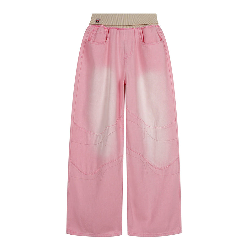 Front view of pink washed wide-leg jeans with beige ribbed waistband and frayed seam detail