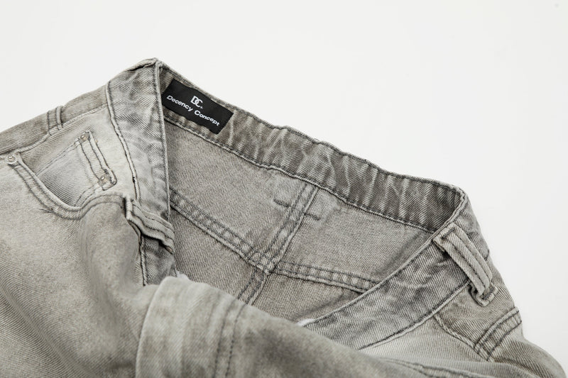 Interior waistband and pocket lining of light gray jeans with black logo label