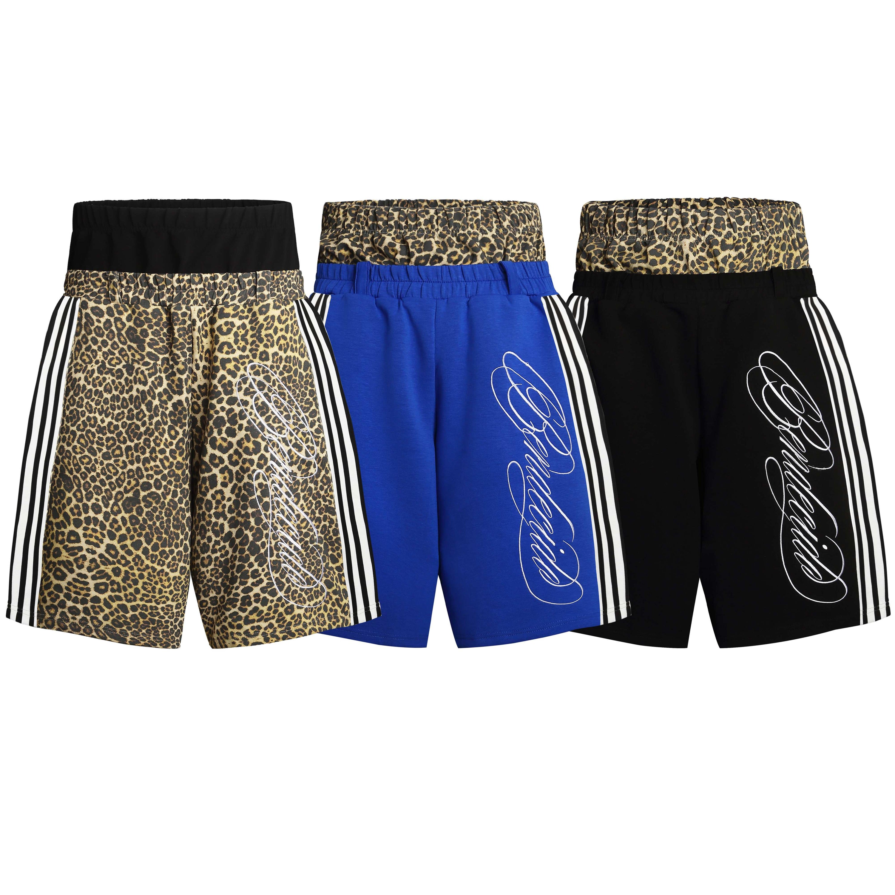 Three Omirad sport shorts in leopard print, royal blue, and black colorways with leopard waistband and side stripe panels