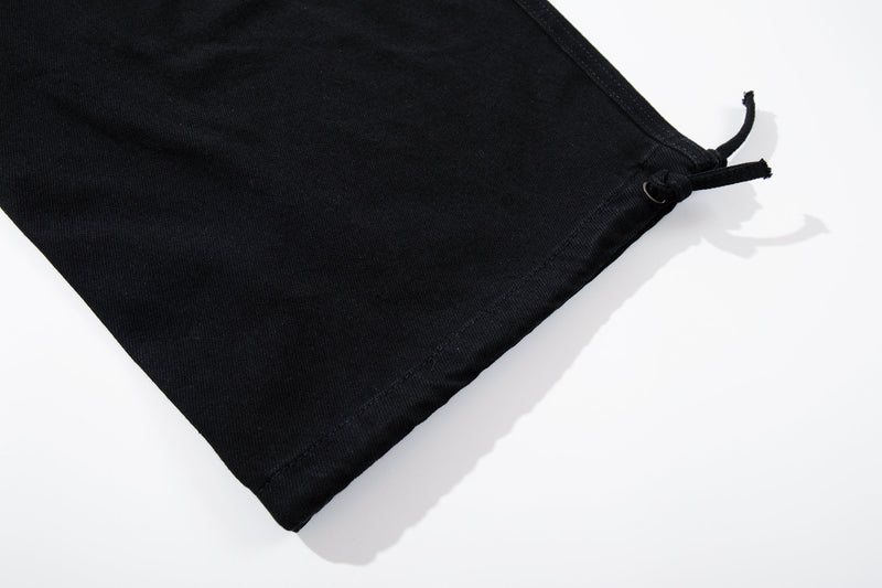 Black wide-leg pant hem with adjustable drawcord tie