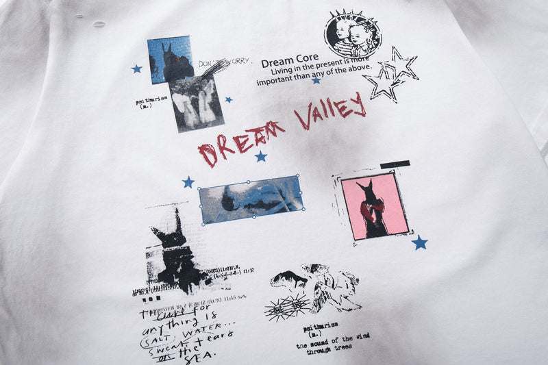 White oversized T-shirt with distressed Dream Valley collage graphic, stars, and red Dream Valley lettering