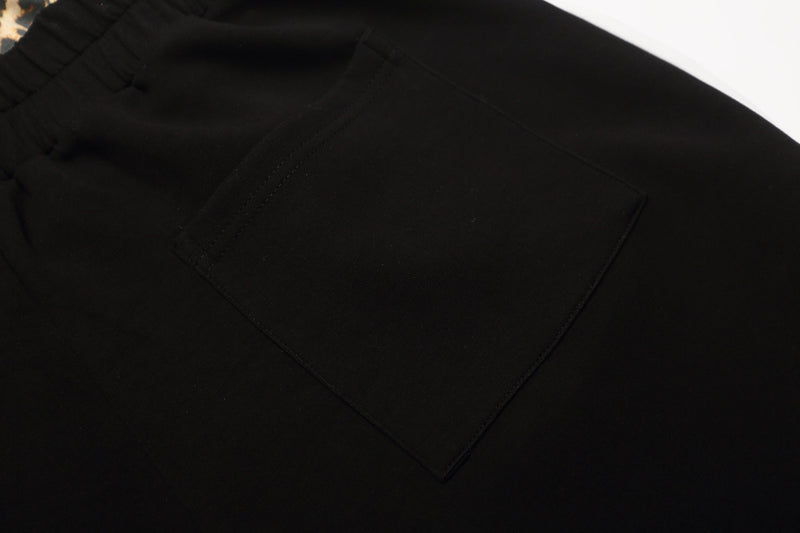 Close-up of black back pocket on the shorts