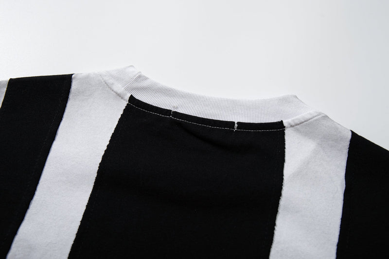 Black and white striped football jersey tee with ribbed crew neck and streetwear style