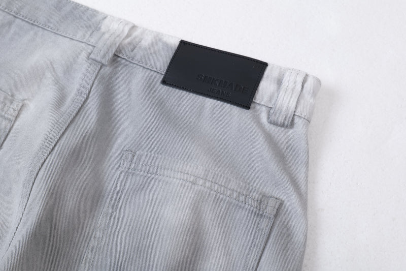 Close-up of the back right waistband showing the black logo label and pocket stitching