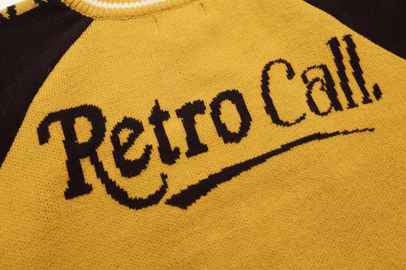 Close-up of Retro Call. text knitted on mustard yellow back panel