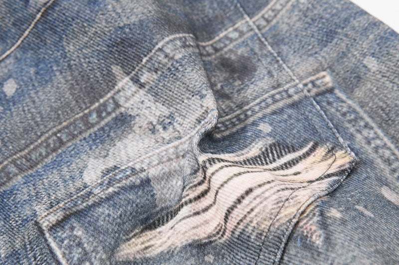 Close-up of back pocket with striped fabric inset and zebra-like patch detail