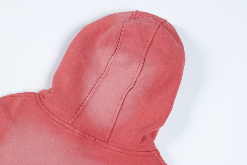 Close-up of red hoodie hood seam and stitched construction