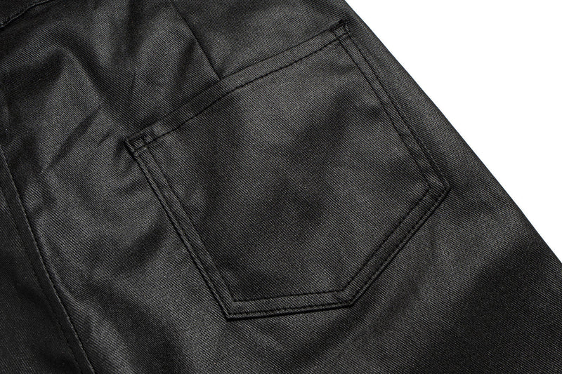 Close-up of back patch pocket on black leather-effect black pants