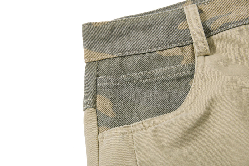 Close-up of beige camo side waistband and front pocket seam