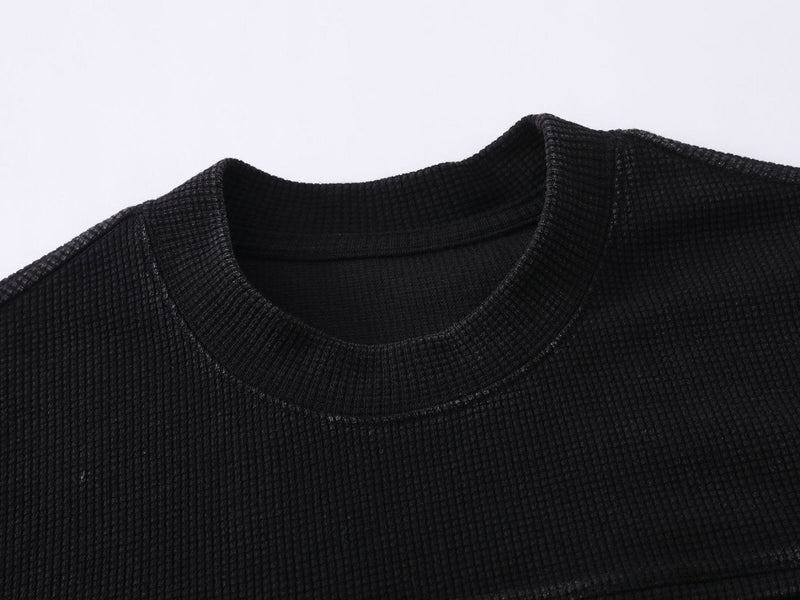 Black waffle knit T-shirt with ribbed crew neckline and textured streetwear fabric detail