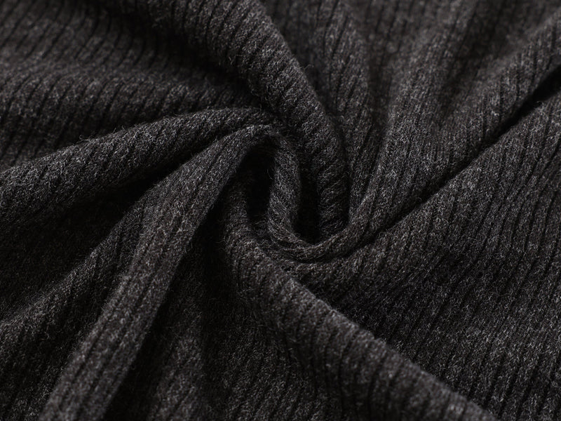 Close-up of black ribbed knit fabric folds and texture