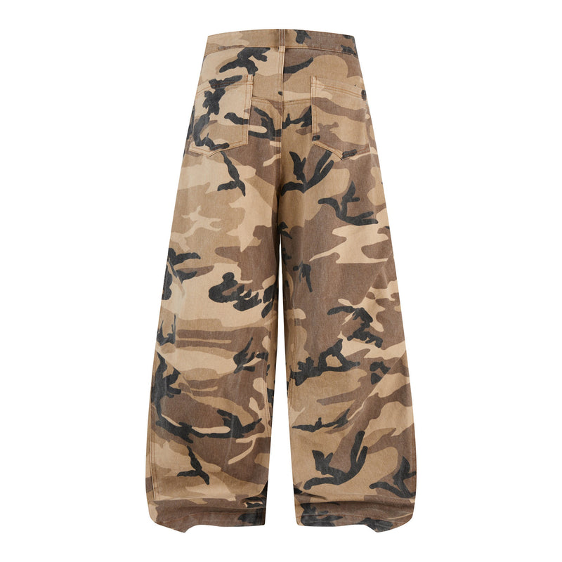 Front view of wide leg desert camo barrel jeans in tan and brown with dark camouflage print