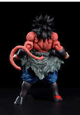 The Seakoff Super Saiyan Broly Collectible Figure from Dragon Ball Z is a detailed 33cm premium action figure with spiky black hair, red fur on the upper body, a long tail, and blue pants. The figure faces away, highlighting its large tail and defined muscles against a black background.