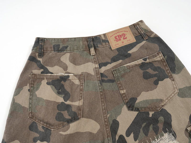 Back waistband and pockets of camouflage cargo shorts with label patch