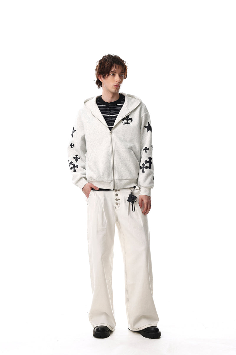 Model wearing light gray hoodie front view with black sleeve graphics and zip closure