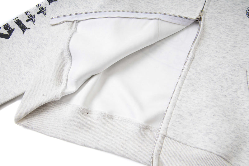 Close-up of white hoodie interior lining and open front zipper