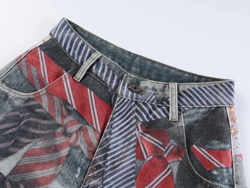 Close-up of jeans waistband with button closure and striped patchwork denim