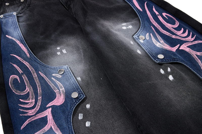 Inside front panel view of black denim jeans with pink graphic side sections