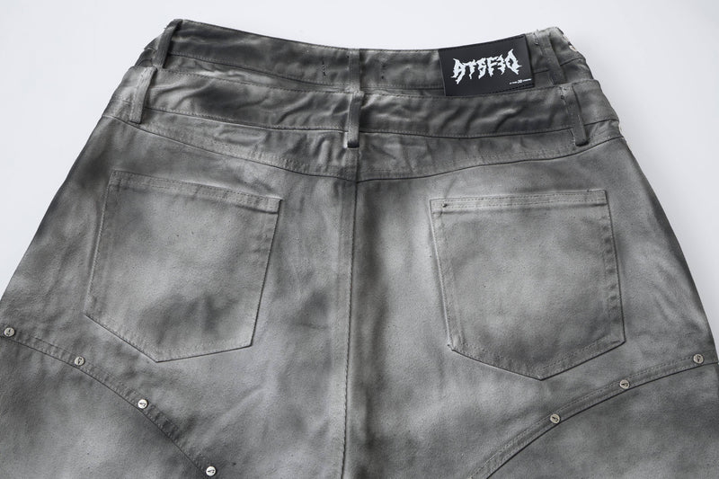 Gray denim jorts back view with plain pockets and faded black waistband