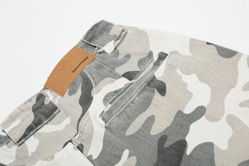 Close-up of the waistband and front pocket area on gray camouflage cargo pants