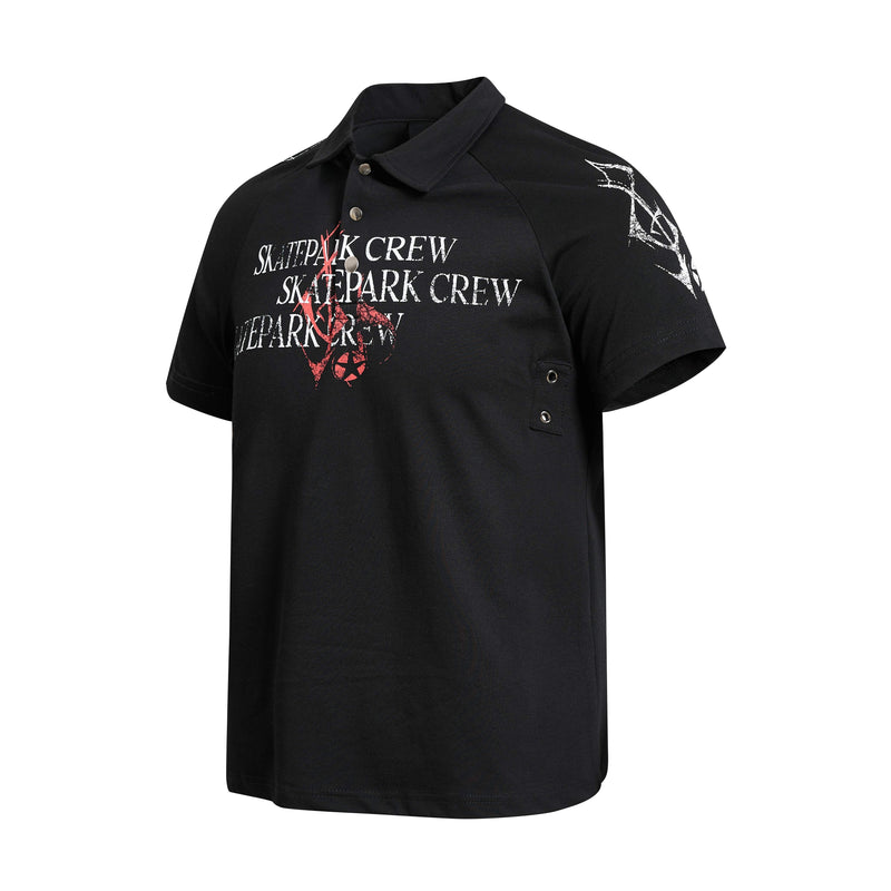 Black distressed graphic polo shirt with skatepark crew print and white-red abstract lettering, short sleeves, and collar