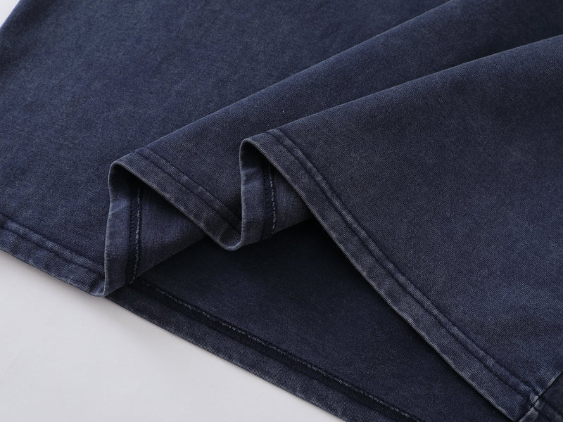 Close-up of folded blue tee fabric and sleeve hem