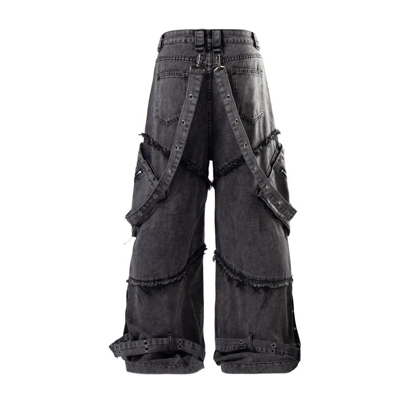 Back view of washed black cargo jeans with strap closures and oversized pockets