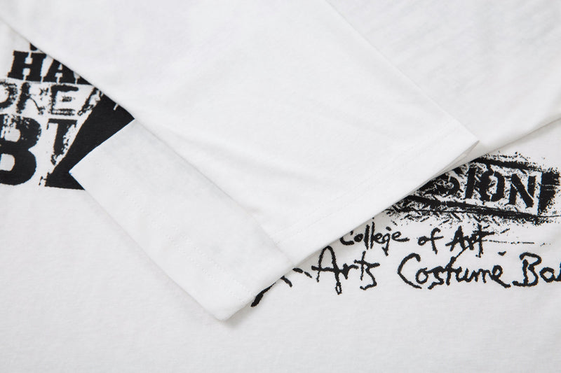 White sleeve and hem overlap with partial black graphic visible on the shirt body