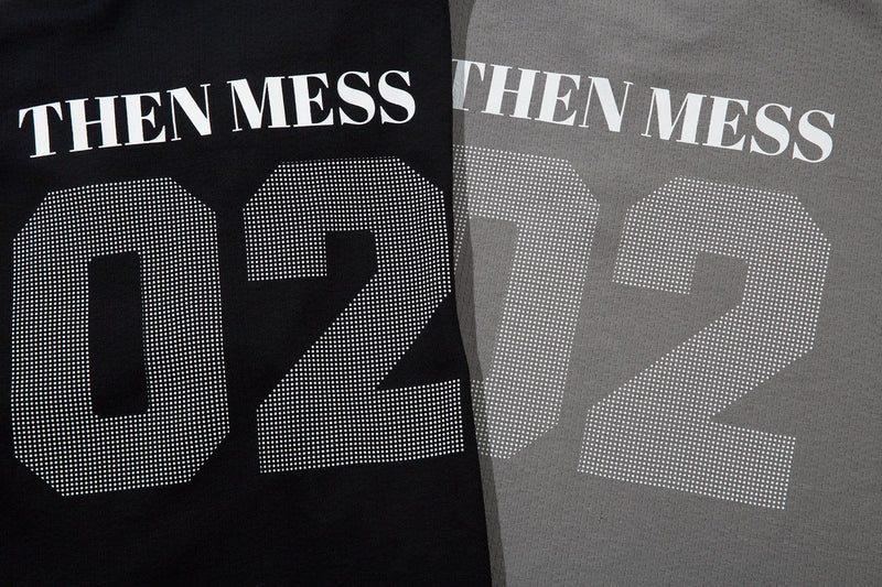 Close-up of THEN MESS text and 02 graphic on black and gray shirt fronts and backs