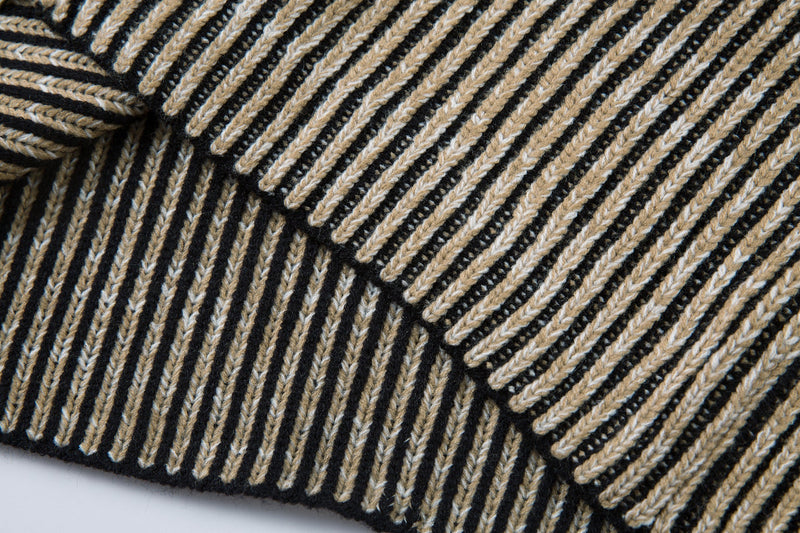 Close-up of the ribbed striped hem on the knit jacket