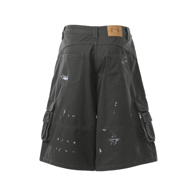 Black cargo shorts back view with square pockets, leather label, and distressed marks