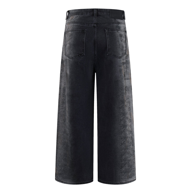 Back view of dark washed wide-leg jeans with two patch pockets and smoky gray fading