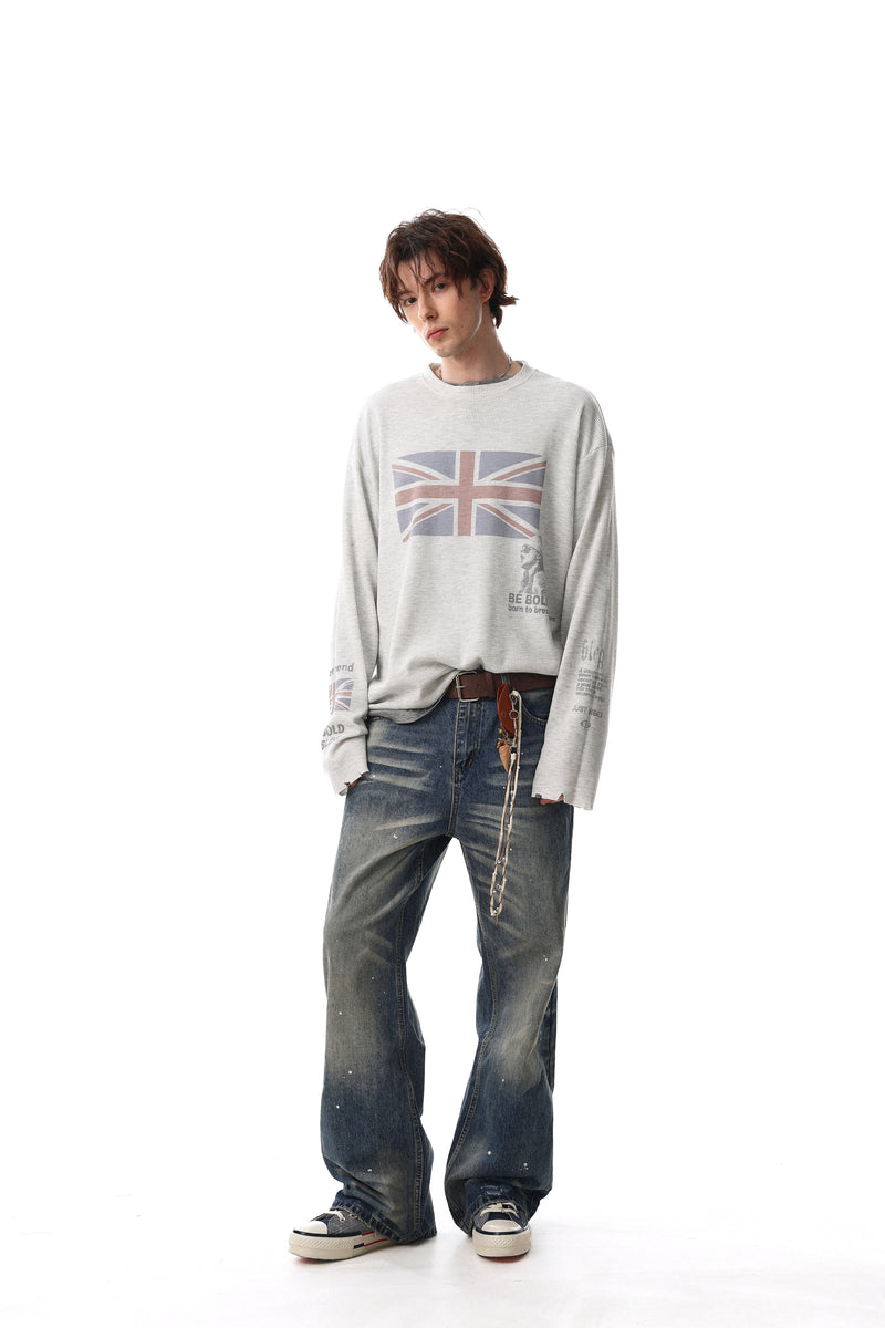 Light gray long sleeve tee on model, front view with Union Jack chest print and wide jeans