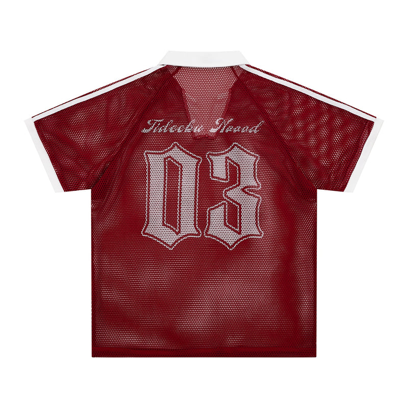 Red vintage mesh polo tee with white collar and varsity-style front lettering on a white background
