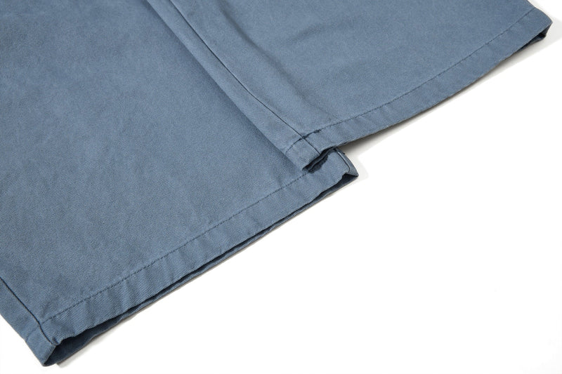 Close-up of blue cargo pant lower leg hem stitching