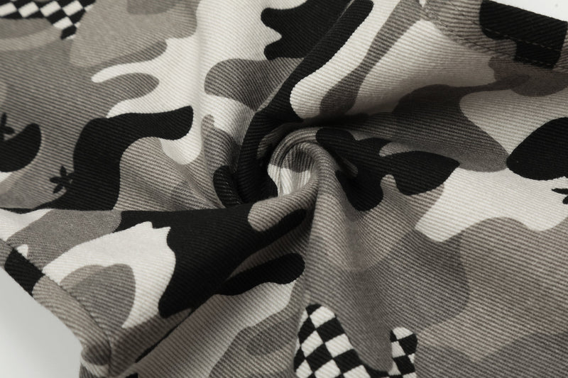 Close-up of grey camo fabric texture with checkerboard patch detail