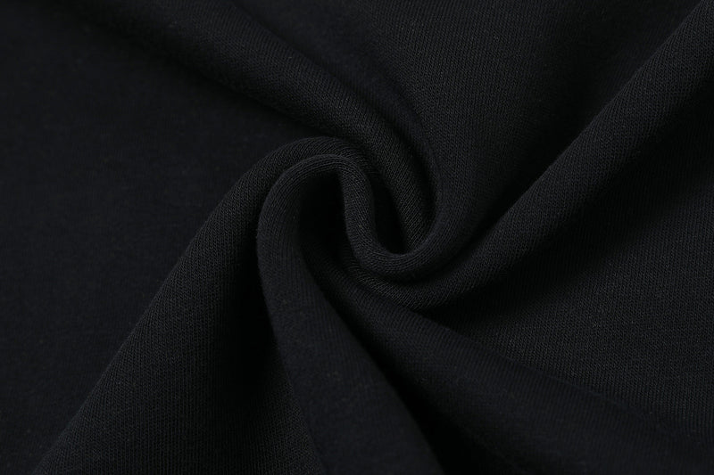 Close-up of black tee fabric with soft textured knit