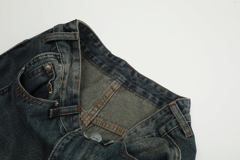 Close-up of front pocket lining and inner waistband on vintage wash jeans