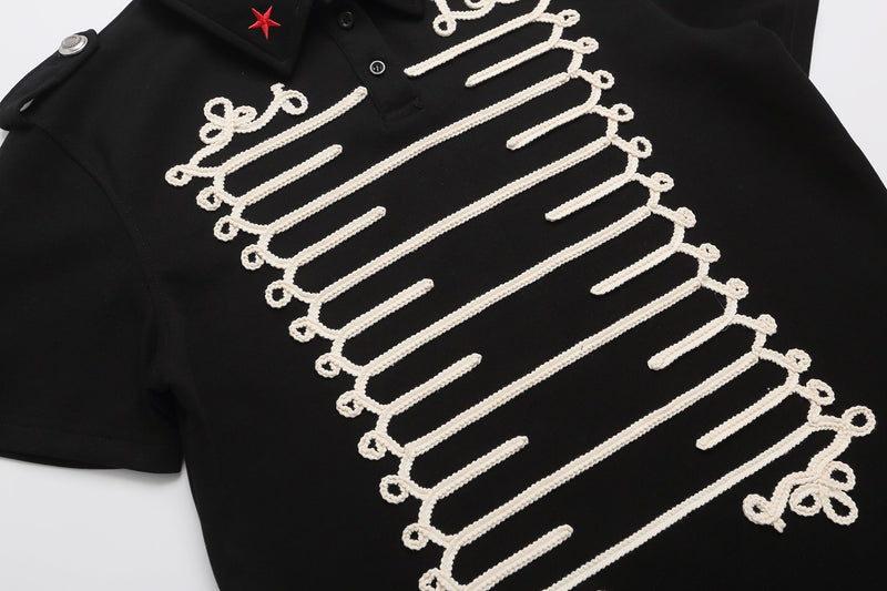 Black polo shirt with white rope braid embroidery, military-style epaulettes, and a red star collar detail