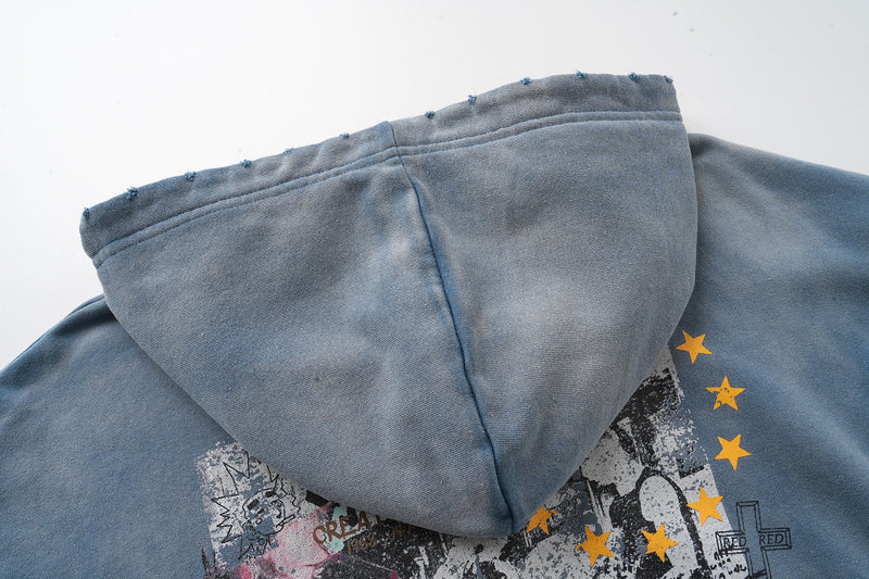 Close-up of hood and upper chest showing faded blue fabric and star print